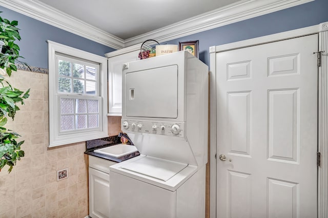 1612 Michael, Clawson, MI 48017 - laundry area with stacked washer and clothes dryer, cabinet space, and ornamental molding