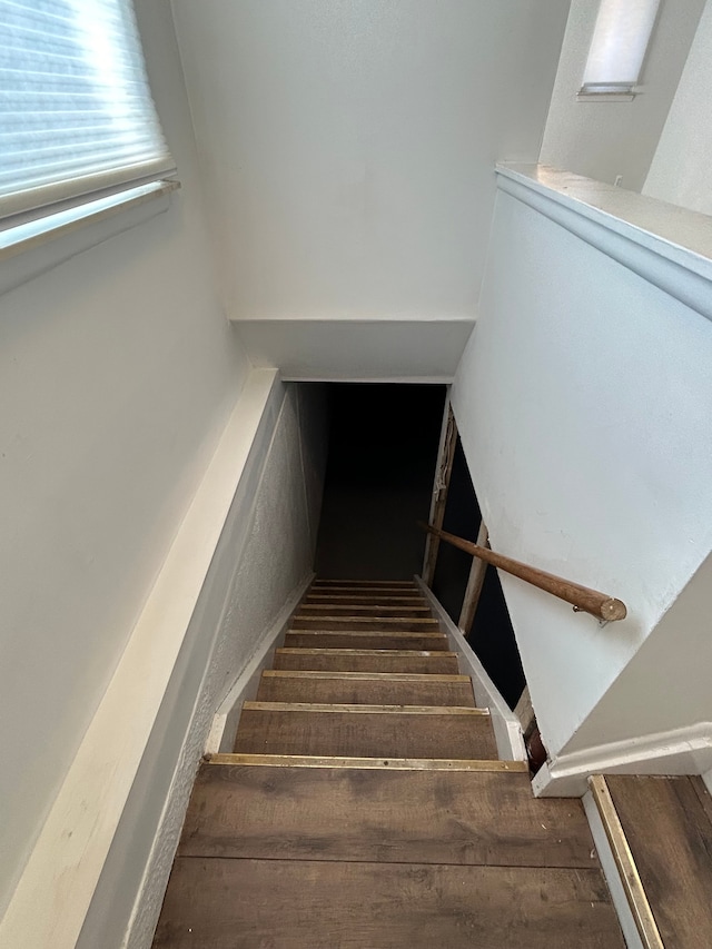 stairway with wood finished floors