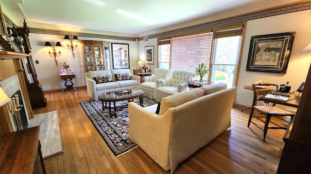 28051 Garfield St, Roseville, MI 48066 - living area featuring wood finished floors, baseboards, and a fireplace