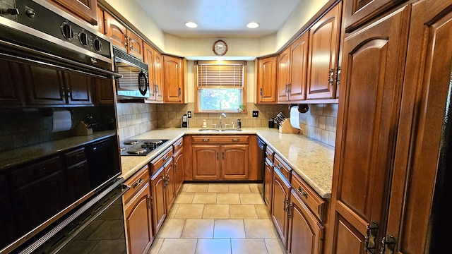 28051 Garfield St, Roseville, MI 48066 - kitchen featuring black appliances, a sink, decorative backsplash, light stone counters, and recessed lighting