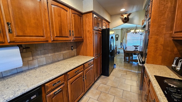 28051 Garfield St, Roseville, MI 48066 - kitchen featuring black appliances, backsplash, light stone countertops, brown cabinets, and recessed lighting