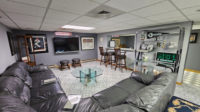 28051 Garfield St, Roseville, MI 48066 - living room with a baseboard heating unit, a paneled ceiling, baseboards, and a bar