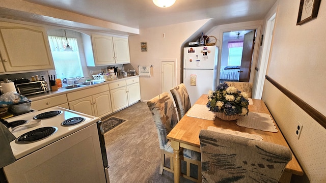 28051 Garfield St, Roseville, MI 48066 - kitchen with white appliances, a sink, and light countertops
