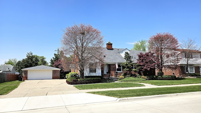 28051 Garfield St, Roseville, MI 48066 - view of front of home featuring brick siding, a chimney, a garage, and driveway