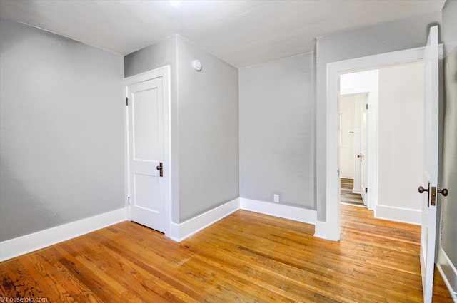 additional living space with light wood-type flooring and baseboards