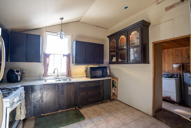 3110 Sigma Rd, Kalkaska, MI 49646 - kitchen with black microwave, a sink, white gas stove, washer / clothes dryer, and vaulted ceiling
