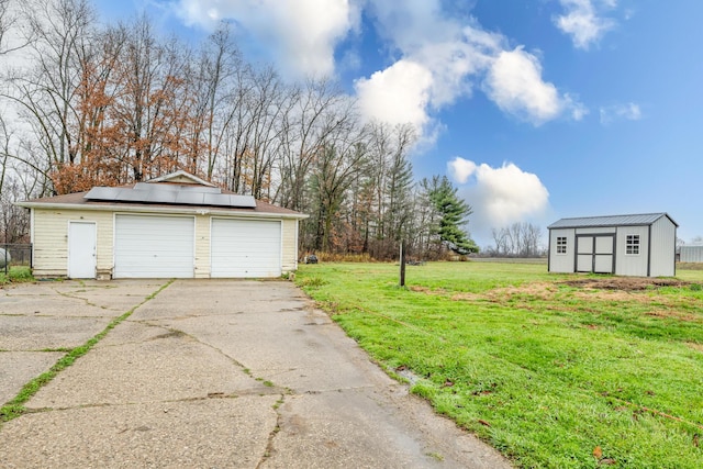5189 W US Highway 12, Three Oaks, MI 49128 - view of green lawn featuring a garage, an outbuilding, and a storage unit