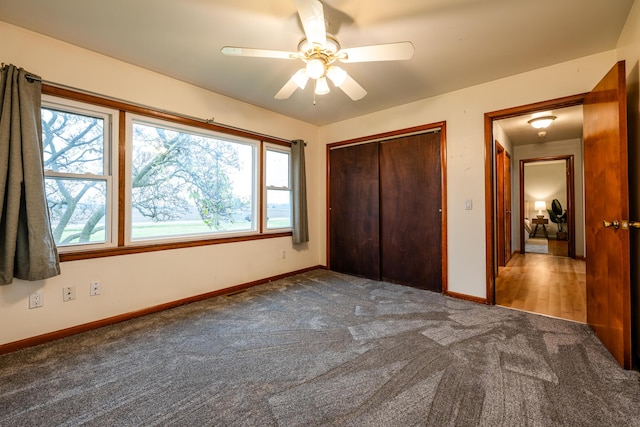 5189 W US Highway 12, Three Oaks, MI 49128 - unfurnished bedroom featuring carpet floors, baseboards, a closet, and a ceiling fan