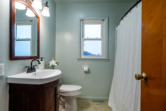 5189 W US Highway 12, Three Oaks, MI 49128 - full bath featuring toilet, vanity, tile patterned flooring, baseboards, and a shower with shower curtain