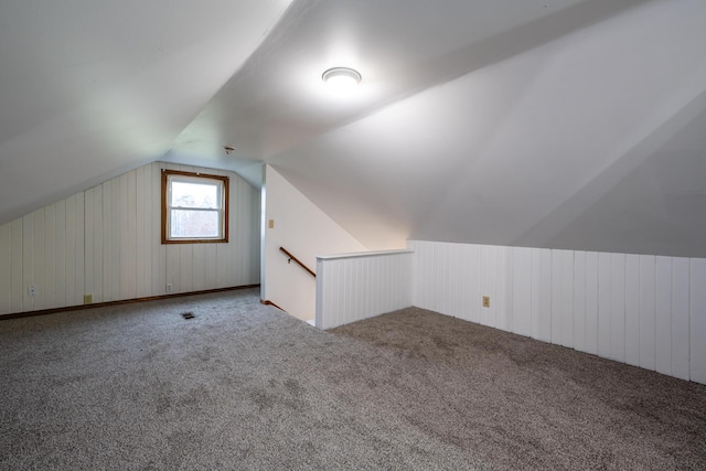 5189 W US Highway 12, Three Oaks, MI 49128 - additional living space featuring vaulted ceiling, carpet, and wooden walls