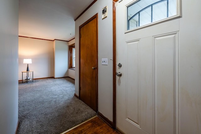 5189 W US Highway 12, Three Oaks, MI 49128 - entrance foyer featuring crown molding, baseboards, and dark colored carpet