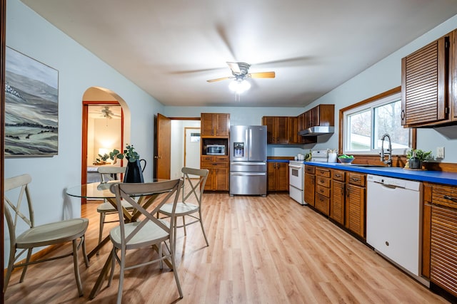 5189 W US Highway 12, Three Oaks, MI 49128 - kitchen featuring stainless steel appliances, a ceiling fan, a sink, under cabinet range hood, and light wood finished floors