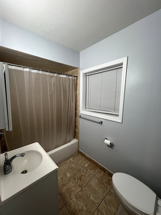 bathroom with toilet, tile patterned flooring, shower / bath combo with shower curtain, baseboards, and vanity