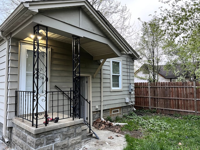 property entrance with fence