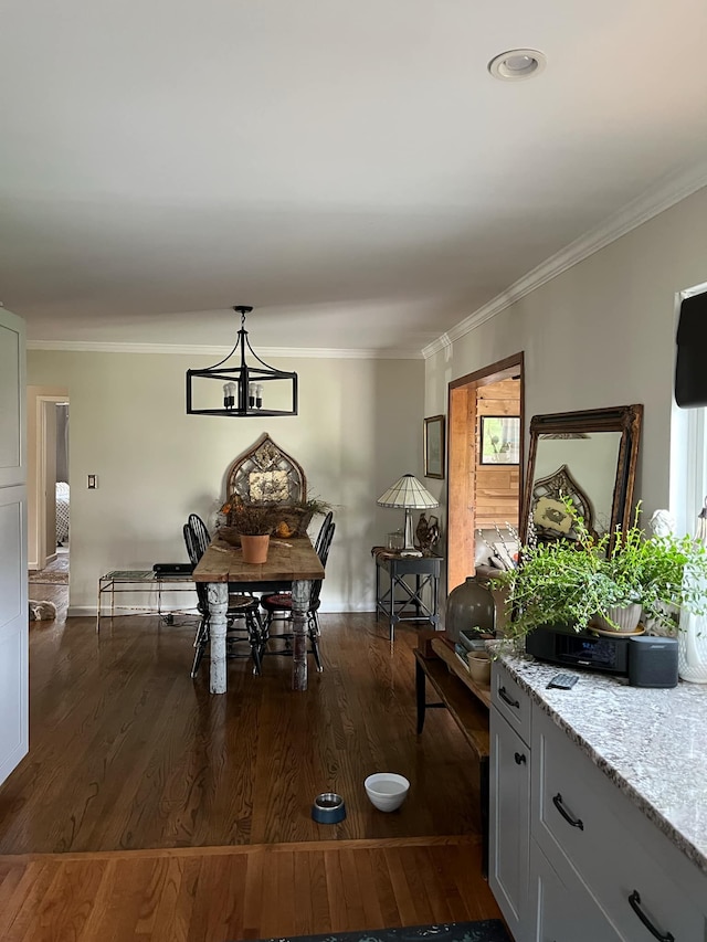 14074 Barbara St, Livonia, MI 48154 - dining area with ornamental molding, dark wood-type flooring, and a chandelier