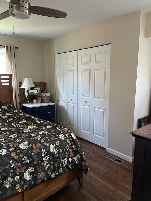 14074 Barbara St, Livonia, MI 48154 - bedroom with dark wood finished floors, a closet, baseboards, and a ceiling fan