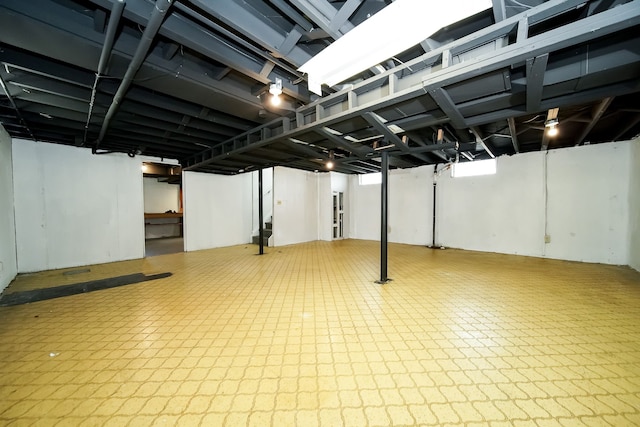 basement with tile patterned floors