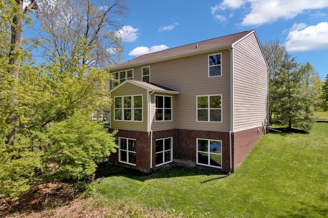 1060 Tinley Blvd, Oxford, MI 48371 - back of property with a yard and brick siding