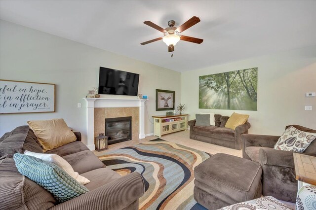 1060 Tinley Blvd, Oxford, MI 48371 - carpeted living area with ceiling fan, a fireplace, and baseboards