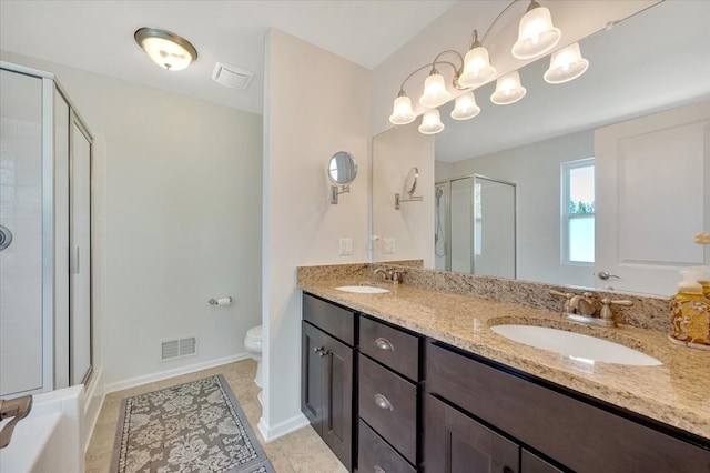 1060 Tinley Blvd, Oxford, MI 48371 - full bathroom featuring a stall shower, toilet, double vanity, tile patterned flooring, and baseboards