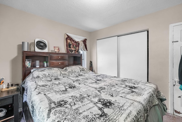 bedroom featuring a closet and a textured ceiling