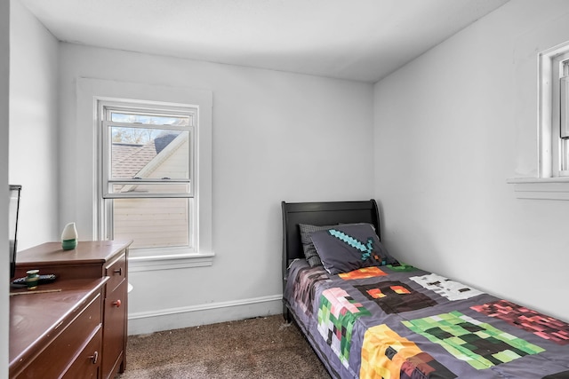carpeted bedroom with baseboards