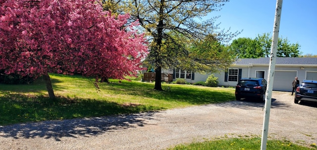 700 S Arent Rd, Watervliet, MI 49098 - view of front of house with driveway, an attached garage, and a front yard