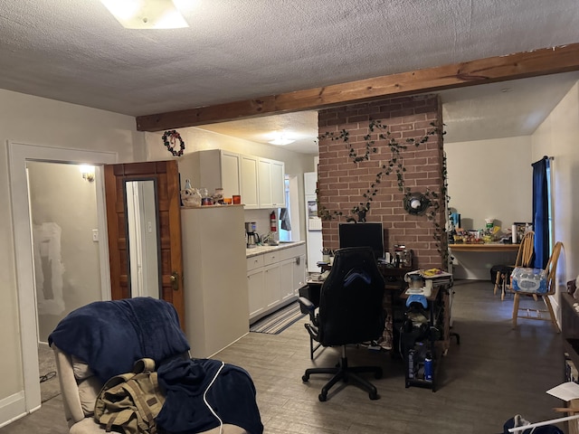 127 N Camburn St, Stanton, MI 48888 - office featuring beam ceiling, wood finished floors, and a textured ceiling
