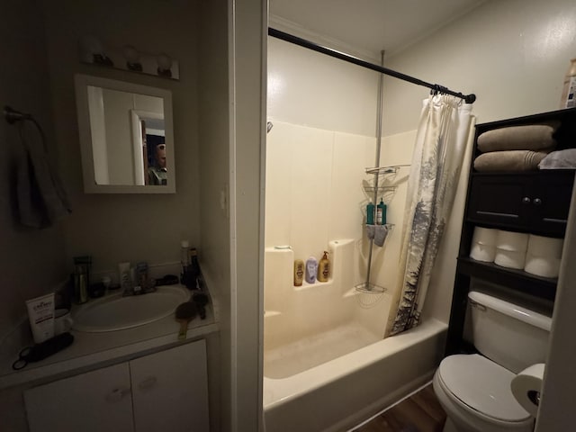 127 N Camburn St, Stanton, MI 48888 - bathroom featuring toilet, shower / bath combination with curtain, and vanity