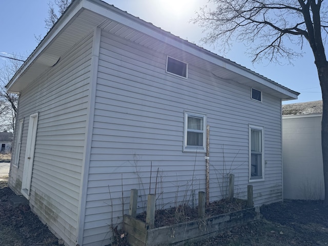 127 N Camburn St, Stanton, MI 48888 - view of side of property featuring metal roof