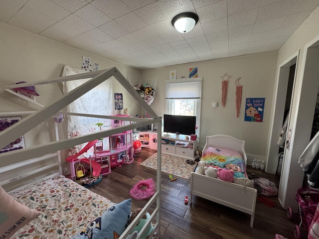 bedroom with wood finished floors