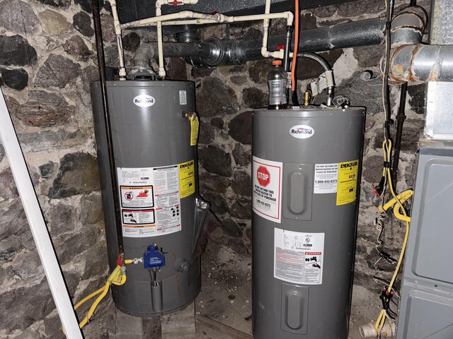 utilities featuring gas water heater and electric water heater