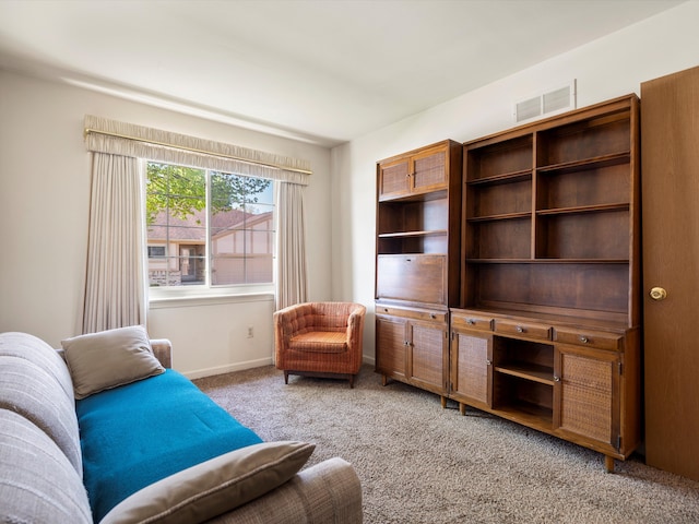 sitting room with carpet flooring and baseboards