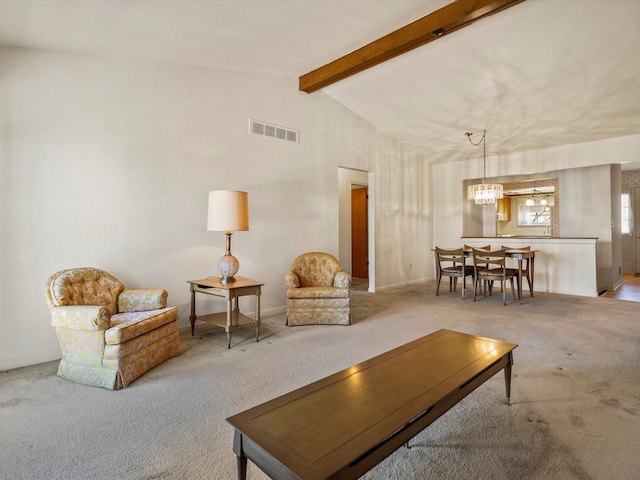 living room featuring carpet flooring and a chandelier