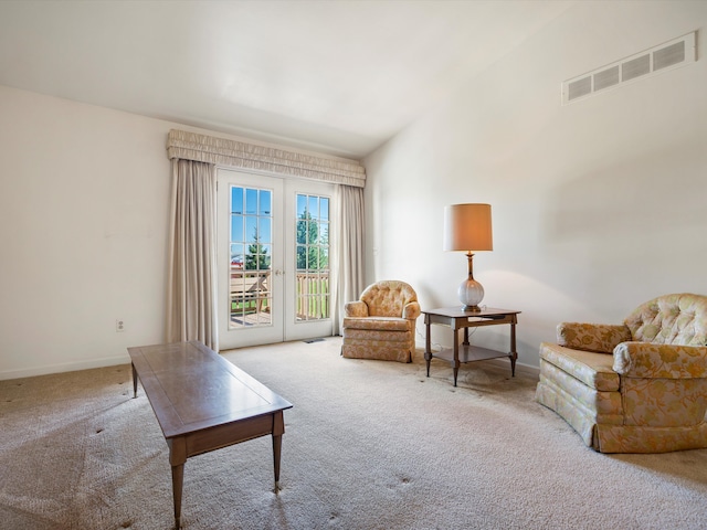 sitting room featuring carpet flooring and baseboards