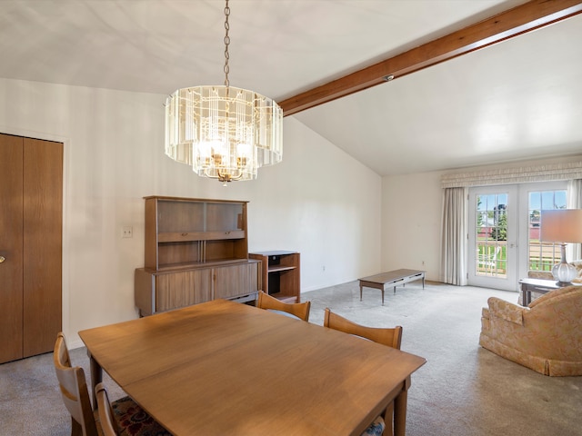 carpeted dining room featuring a chandelier
