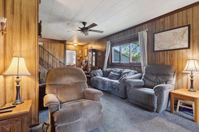 12948 Peck Ave, Sawyer, MI 49125 - living room with carpet flooring, wood walls, stairs, ceiling fan, and crown molding