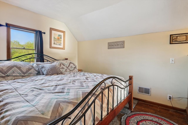 12948 Peck Ave, Sawyer, MI 49125 - bedroom featuring wood finished floors, lofted ceiling, and baseboards