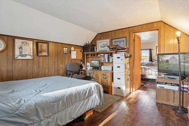 12948 Peck Ave, Sawyer, MI 49125 - bedroom featuring lofted ceiling, wood walls, hardwood / wood-style floors, and a textured ceiling