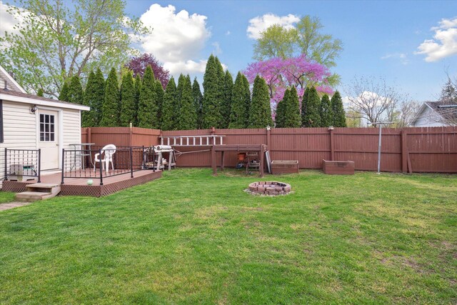 12948 Peck Ave, Sawyer, MI 49125 - view of yard with a wooden deck and an outdoor fire pit