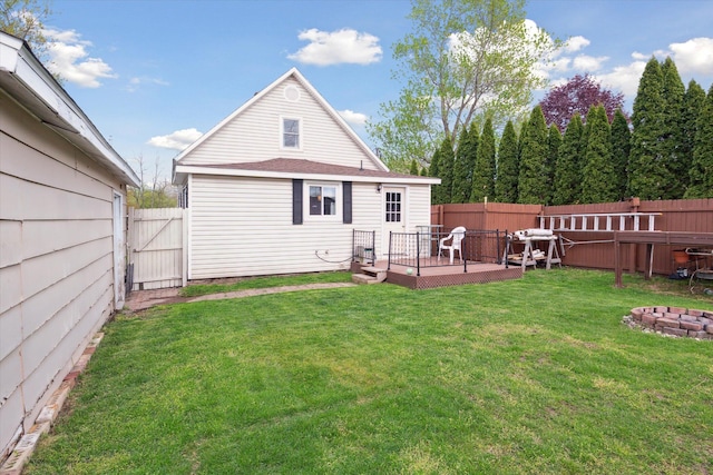 12948 Peck Ave, Sawyer, MI 49125 - back of house with a deck, a gate, and a fire pit