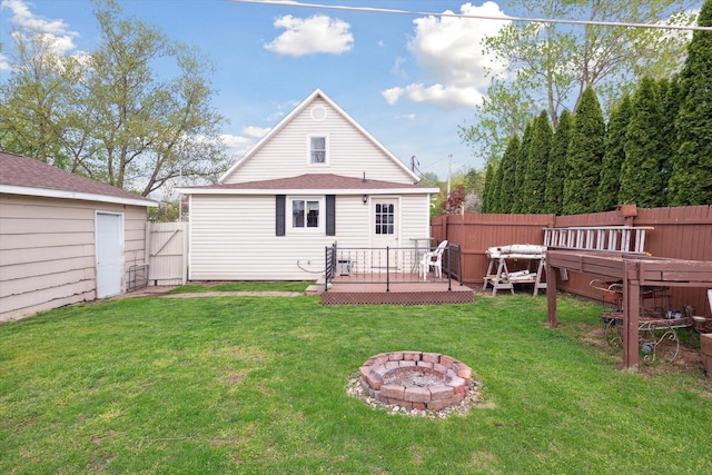 12948 Peck Ave, Sawyer, MI 49125 - rear view of property featuring a wooden deck and an outdoor fire pit
