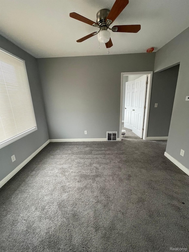 7910 Wetherby St, Detroit, MI 48210 - carpeted empty room with ceiling fan and baseboards