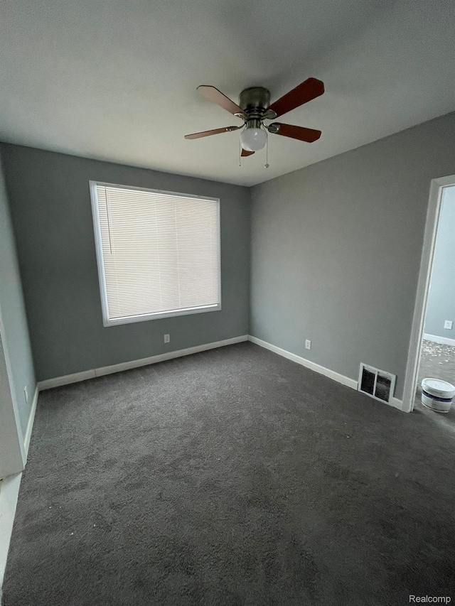 7910 Wetherby St, Detroit, MI 48210 - spare room with dark carpet and a ceiling fan