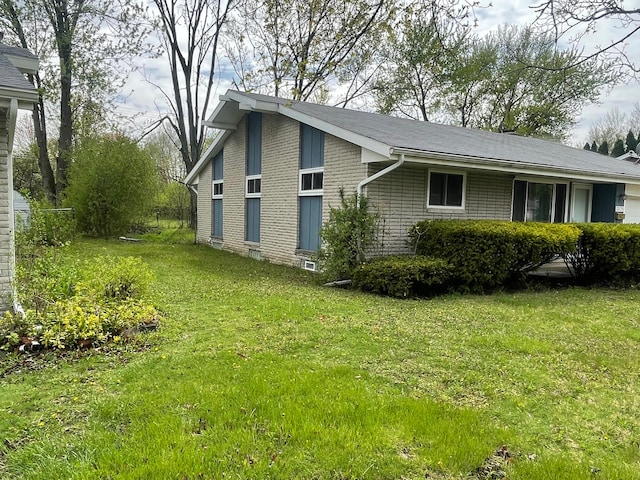 20225 Ledgestone St, Southfield, MI 48076 - view of property exterior featuring a yard and brick siding