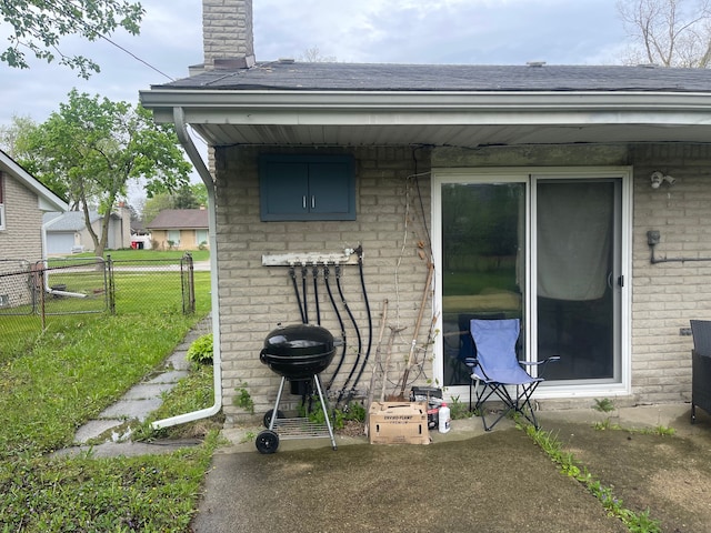 20225 Ledgestone St, Southfield, MI 48076 - back of property featuring a shingled roof, brick siding, and a chimney