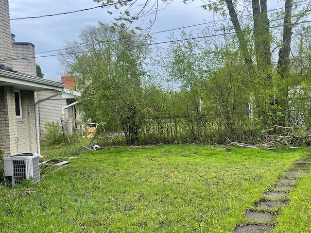 20225 Ledgestone St, Southfield, MI 48076 - view of green lawn with central air condition unit