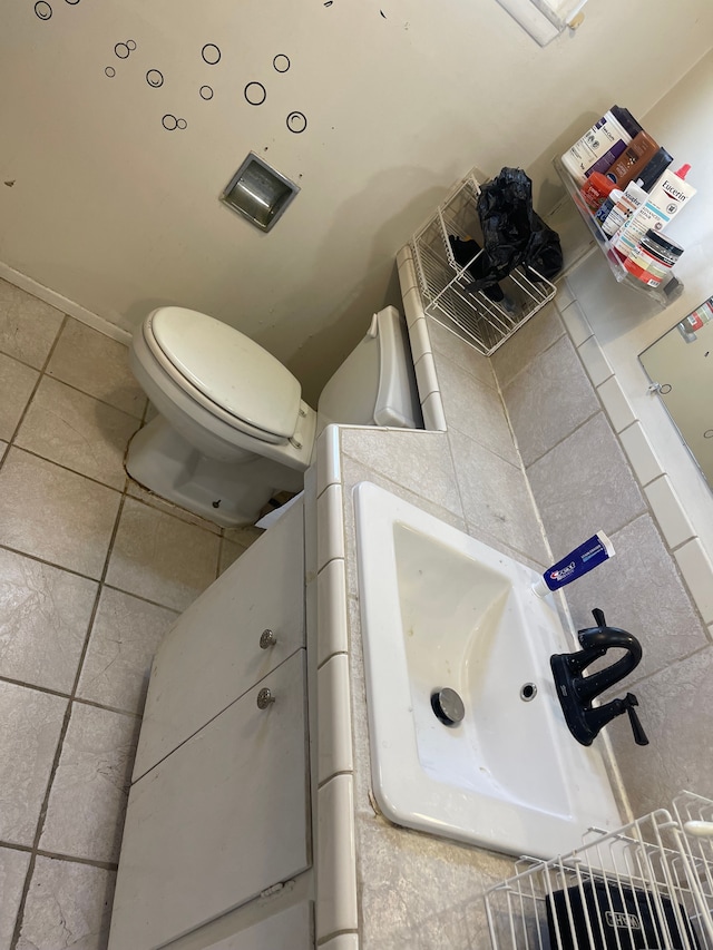 20225 Ledgestone St, Southfield, MI 48076 - bathroom with toilet, tile patterned flooring, and a sink