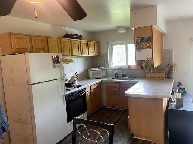 20225 Ledgestone St, Southfield, MI 48076 - kitchen with white appliances, tile counters, dark wood-style flooring, under cabinet range hood, and tasteful backsplash