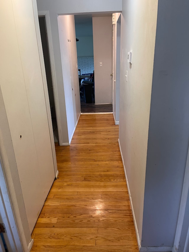 20225 Ledgestone St, Southfield, MI 48076 - hallway featuring light wood-style flooring and baseboards